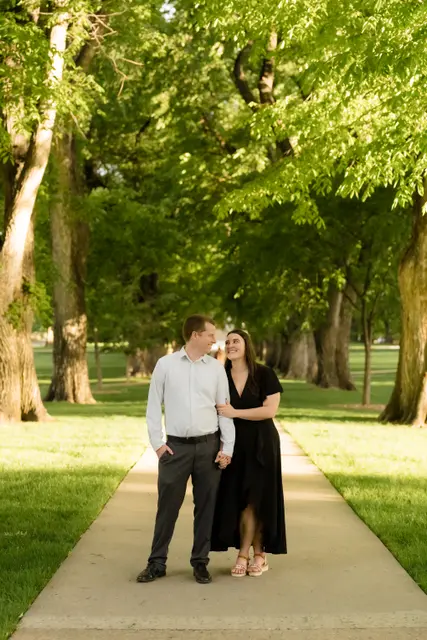 Leaning into each other on the walkway under the elm canopy