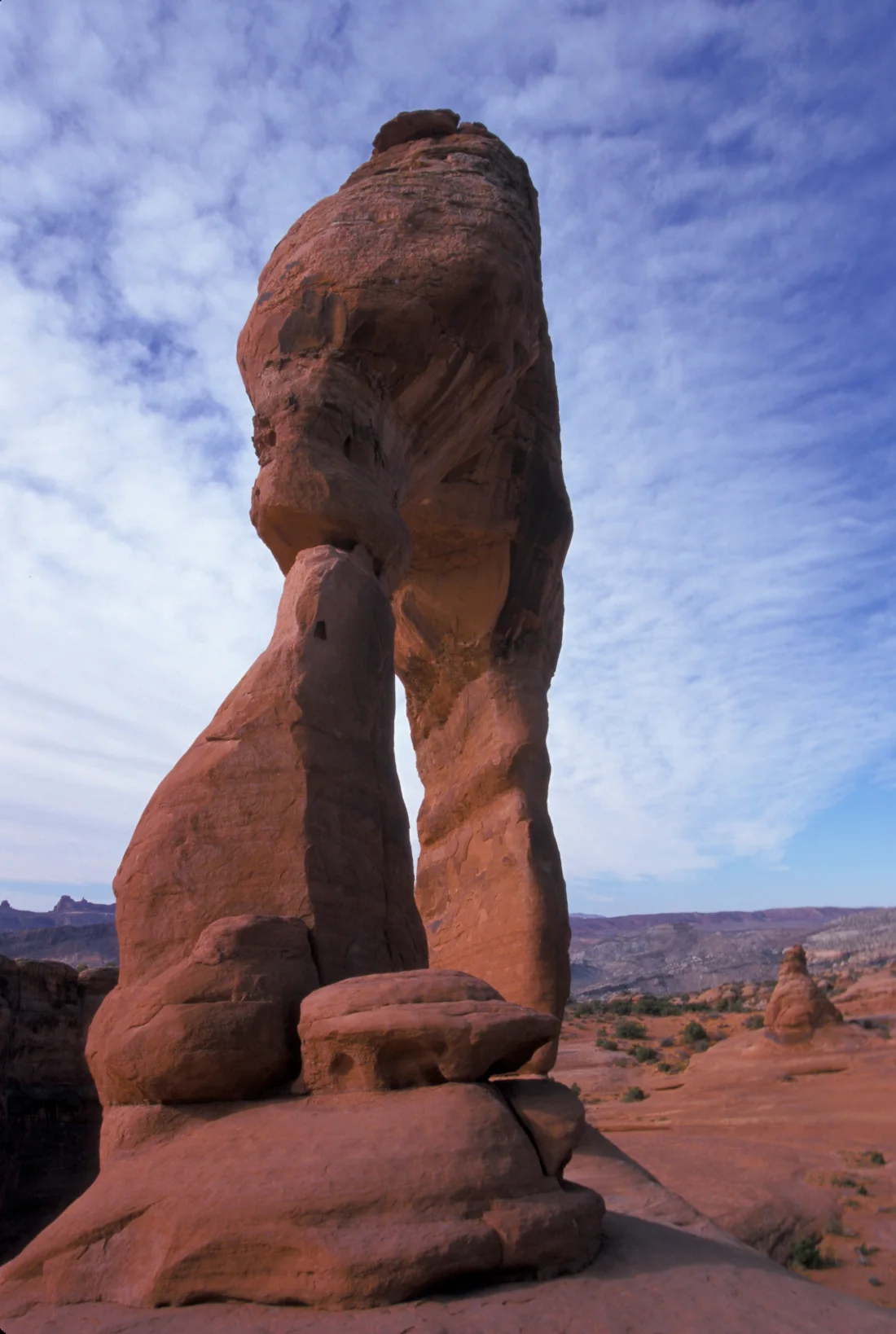 Delicate Arch rising above the red sandstone landscape in Arches National Park